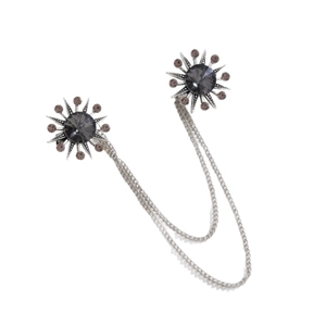 Vintage sunburst brooch with double chains and dark grey crystal in a silver setting