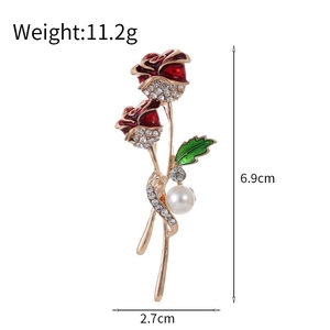 Detail view of red enamel rose brooch with dimensions of 6.9cm height and 2.7cm width