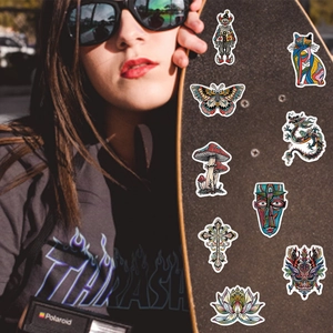 Vibrant grotesque style waterproof PVC graffiti stickers on a trendy street skateboard