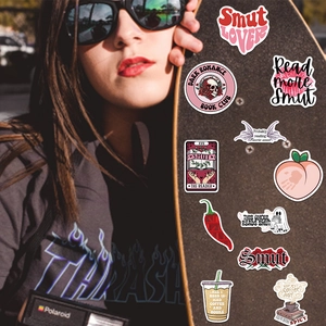 52-pack of waterproof bookish stickers featuring book club and smut lover theme on skateboard
