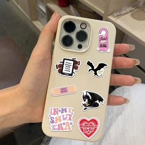 Close-up of waterproof bookish stickers featuring reading quotes on a smartphone case