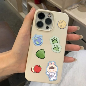 Close-up of cream white phone case with cute cartoon bunny and space illustrations