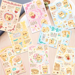 Detailed close-up of cute butter bear stickers with colorful illustrations and slogans