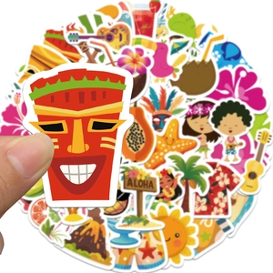 Close-up of tropical summer graffiti stickers including Tiki mask and Aloha signs