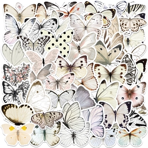 Flat lay variety of aesthetic waterproof butterfly stickers for scrapbooking and crafts