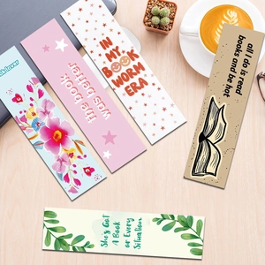 Set of 5 creative cartoon bookmarks with floral and quote designs on wooden desk