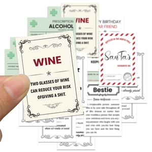 Close-up of waterproof PVC wine bottle stickers with humorous English quotes