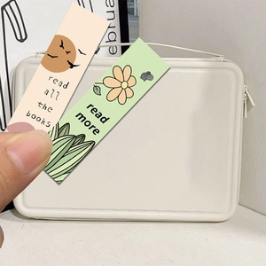 Detail of two creative cartoon reading bookmarks with inspirational quotes held by hand