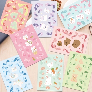 Macro view of colorful cartoon animal stickers and ribbon motifs for DIY crafts