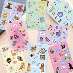 Detailed view of 8 cute cartoon pet PVC stickers scattered on a light wood background