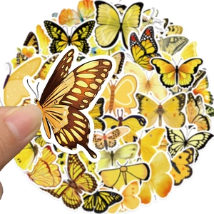 Close-up of yellow butterfly stickers with clear white outlines for planners