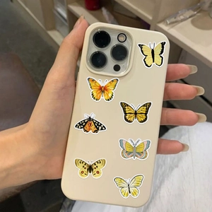 Close-up of colorful waterproof butterfly stickers on a mobile phone case for decoration