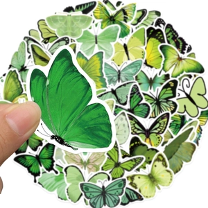 Detail of green butterfly stickers set with precise die-cut edges for scrapbooking