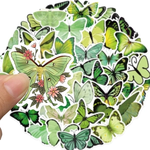 Close-up of green butterfly stickers showing waterproof PVC texture and precise die-cut edges