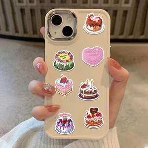 Detailed view of cream phone case featuring cute cartoon zodiac cake stickers and designs