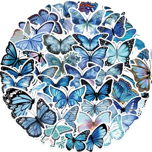 Detailed view of assorted blue waterproof PVC butterfly stickers with precision die-cut edges