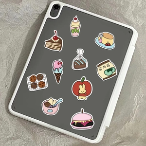Close-up of colorful cartoon food stickers on a tablet case with high saturation detail