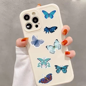 Detail of colorful butterfly patterns on an off-white protective smartphone case