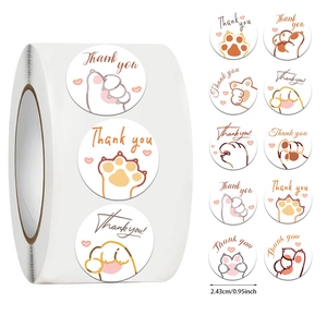 Close-up of 500-count cute cat paw thank you stickers with 0.95 inch diameter and warm tones