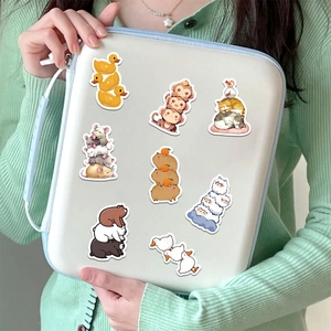 Cute stackable animal stickers on tablet case featuring capybara, ducks and bears