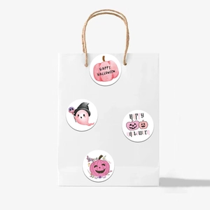 Cute pink Halloween stickers with pumpkin and ghost designs on white paper bag