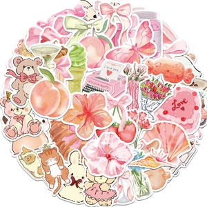 Détail d'autocollants décoratifs roses avec ours en peluche, cœurs et motifs floraux