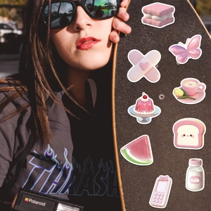 Close-up of pink 3D graffiti stickers featuring cute butter and milk bottle designs