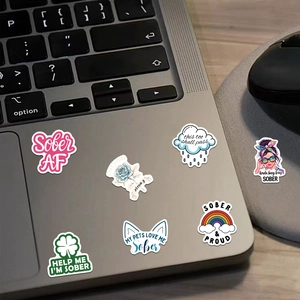 Set of 50 colorful cartoon Sobriety stickers on laptop with slogans like Sober AF