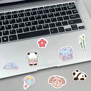 Cute waterproof cartoon animal stickers featuring elephant and panda on a silver laptop