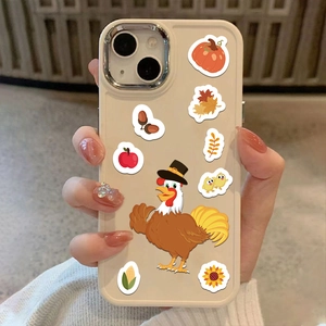 Close-up of cream silicone iPhone case featuring festive turkey and pumpkin stickers
