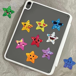 Glitter star emoji stickers set applied on a tablet case for decorative display