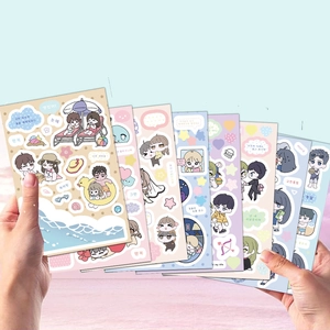 Macro view of cartoon academic holiday stickers for DIY scrapbooking and planners