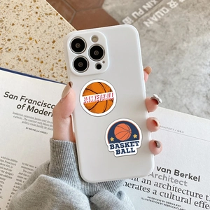 Close-up of mini basketball stickers applied on a white silicone iPhone case