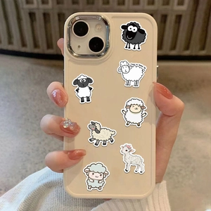 Close-up of cute cartoon sheep stickers applied on a cream-colored iPhone phone case