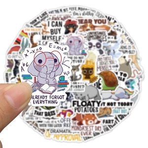 Close-up of waterproof animal stickers with funny quotes for luggage and laptop