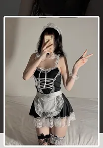 Detail view of sexy French maid cosplay costume set with lace trim and apron accessories