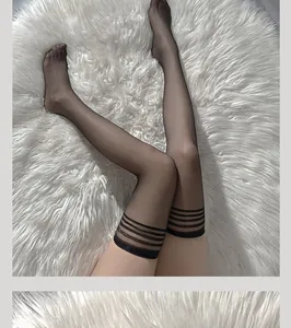 Detailed view of sheer black thigh high stockings featuring triple athletic stripes at the top