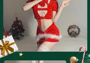 Detailed view of red velvet Christmas lingerie set with white lace trim on festive background