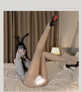 Macro detail of ultra-thin shiny silver crotchless stockings with silky transparent texture