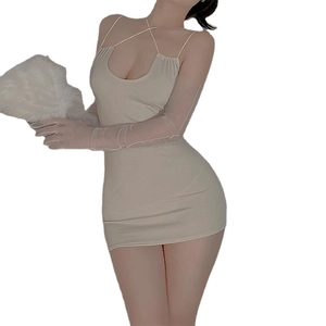 Beige bodycon mini dress with criss-cross halter neckline and sheer mesh long sleeves
