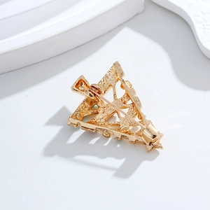 Golden Christmas tree brooch with star detail and secure locking pin back view