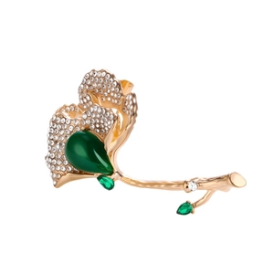 Ginkgo leaf brooch with sparkling rhinestones and green crystal in gold finish