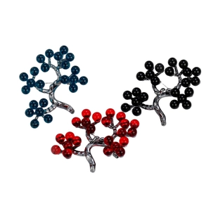 Fashionable tree-shaped winter holly berry brooches in blue, red, and black finishes