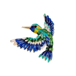 Exquisite hummingbird brooch with colorful enamel wings in a gold-plated alloy finish