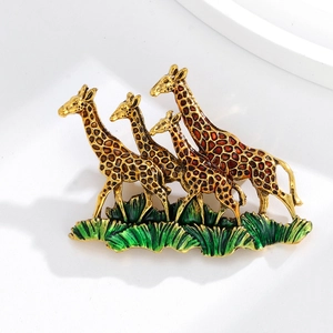 Charming enamel giraffe family brooch with mother and calves on green grass base