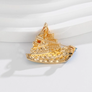Exquisite gold sailboat brooch for suits showing the detailed back metal pin structure
