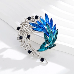 Luxurious crystal phoenix tail flower brooch with blue marquise gems and silver base