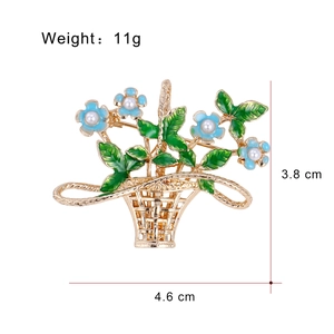 Elegant gold flower basket brooch with blue enamel flowers and white pearls