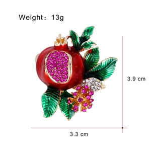 Pomegranate brooch pin with red enamel fruit and sparkling pink crystal leaf accents