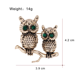 Vintage gold owl brooch pins for women featuring green gemstone eyes and clear texture